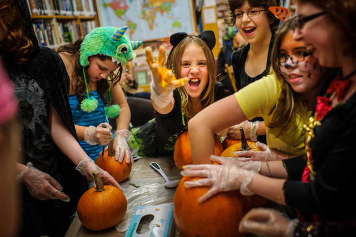 Girl Power! attendees carve pumpkins for Halloween