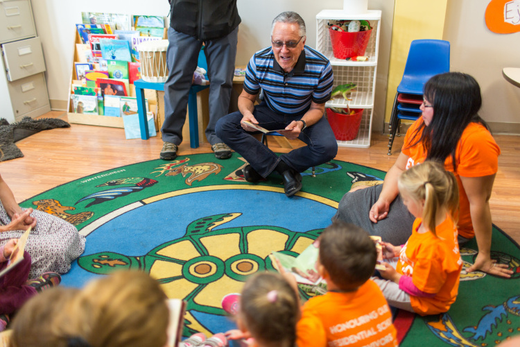 Author reads to people in a library